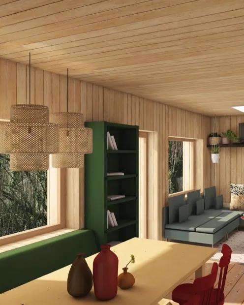 Séjour aménagé en bardage bois clair avec bibliothèque vert forêt, banquette et grande baie sur le jardin