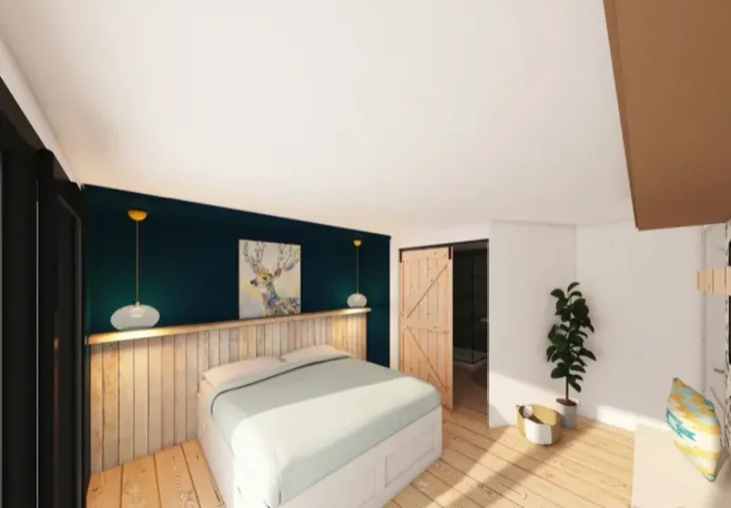 Suite parentale avec mur bleu canard, tête de lit en lambris bois et porte coulissante de grange
